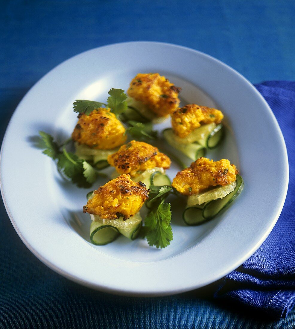 Chermoula fish on cucumber and lime slices