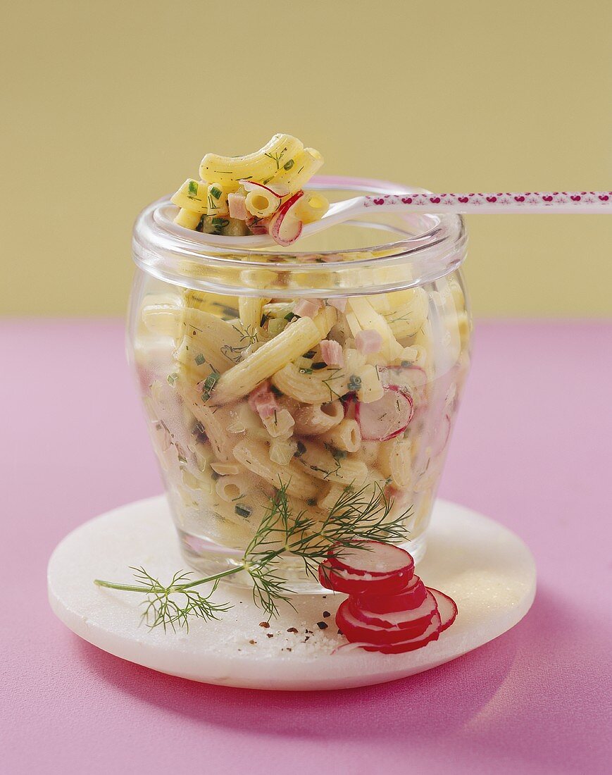 Pasta salad with ham, cheese and radishes