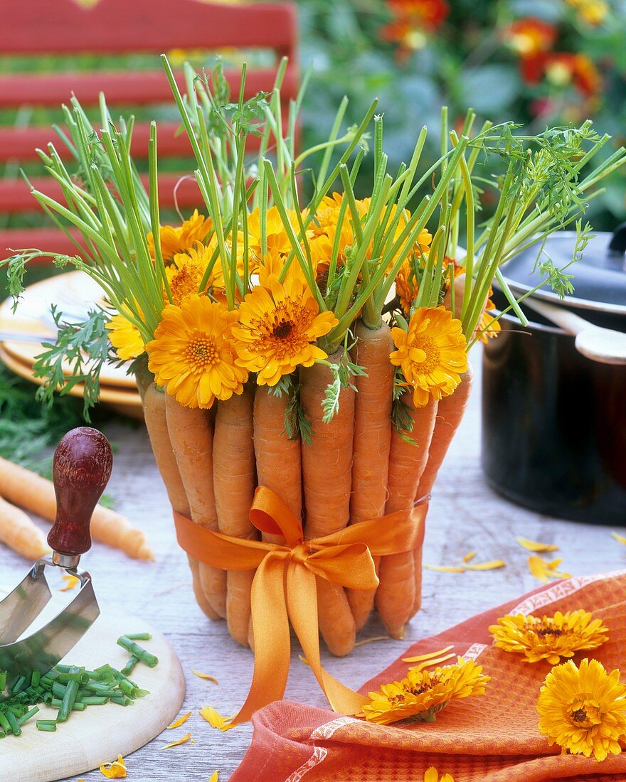 Arrangement of carrots and marigolds