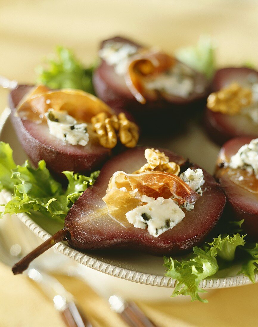 Red wine pears with Roquefort, Parma ham and walnuts