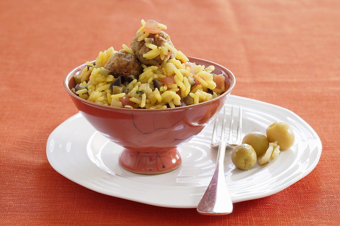 Saffron rice with aubergine and meatballs