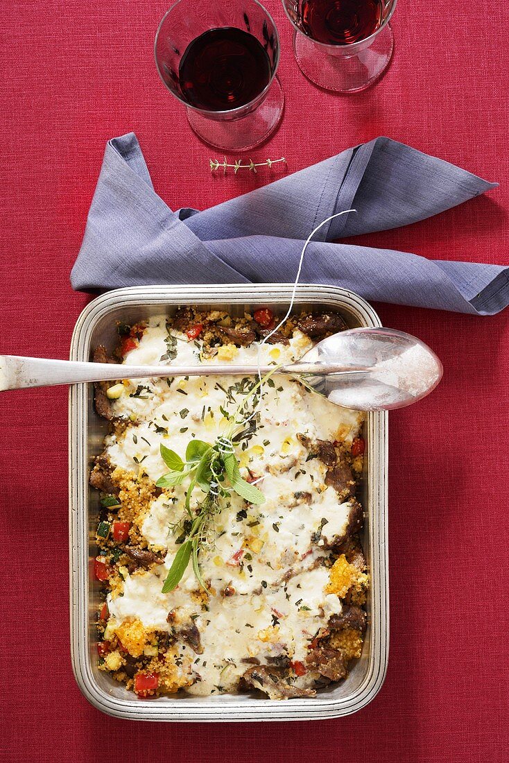 Oven-baked lamb with couscous and feta cheese