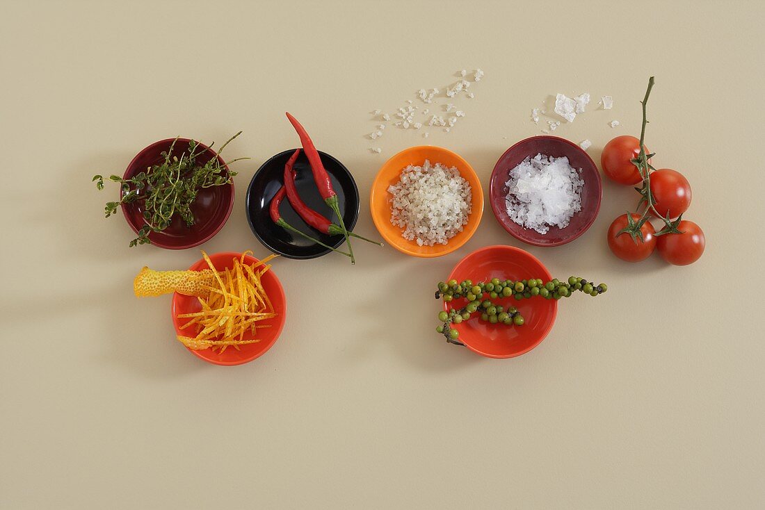 Spices, chillies, herbs, orange zest for garnishing