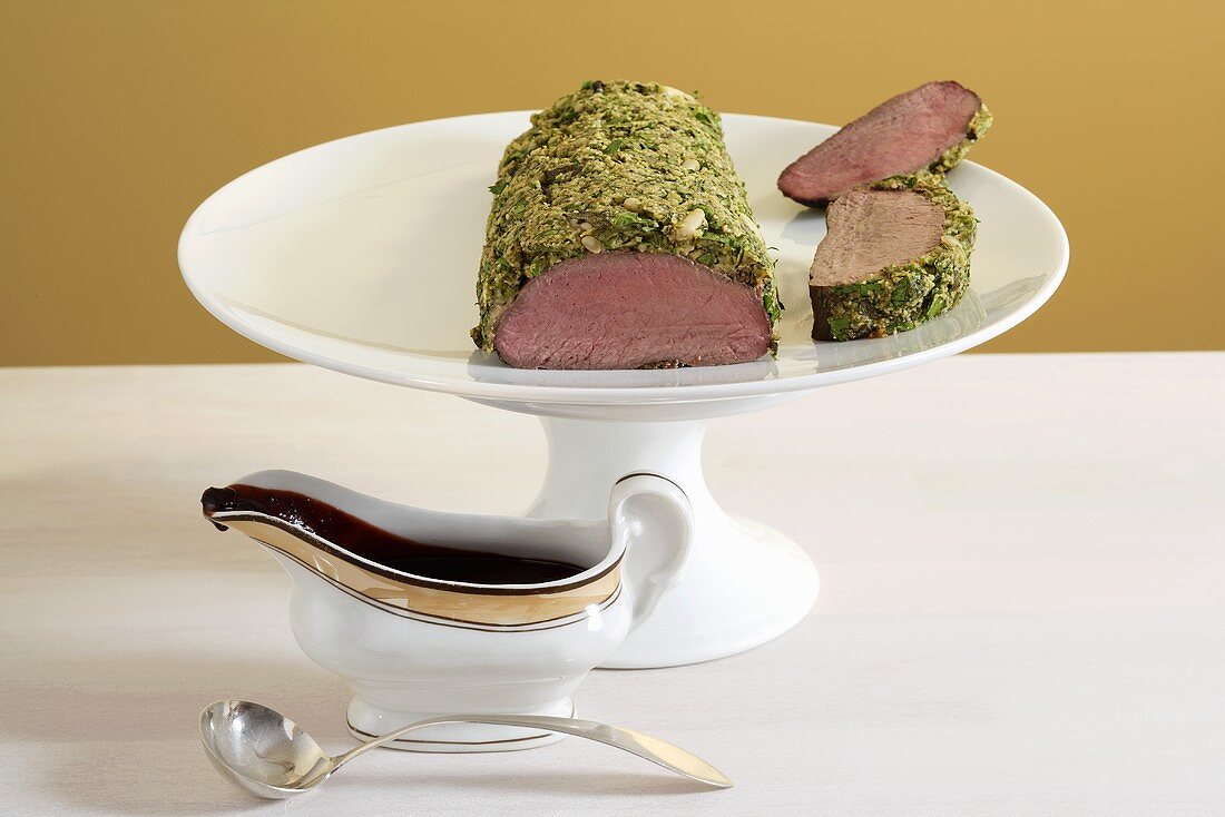 Venison fillet with herb crust and chocolate sauce