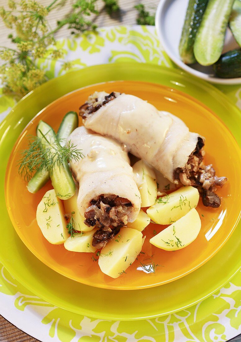 Fish rolls with dill potatoes and gherkin