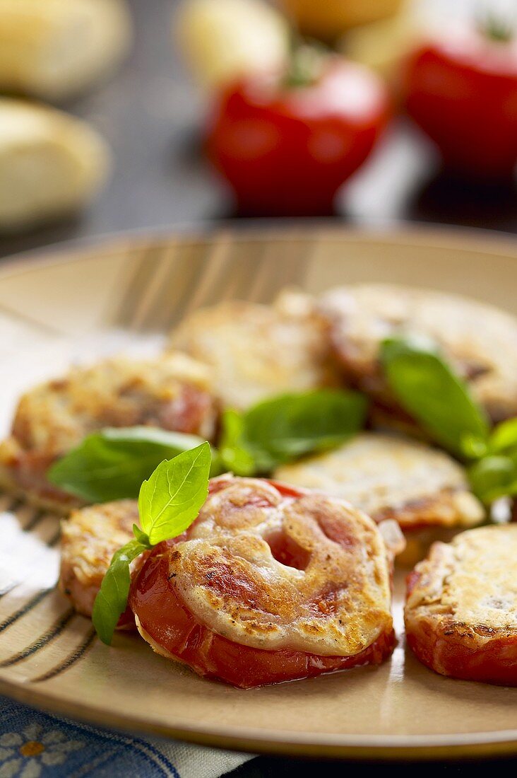 Tomatoes au gratin with mozzarella and basil