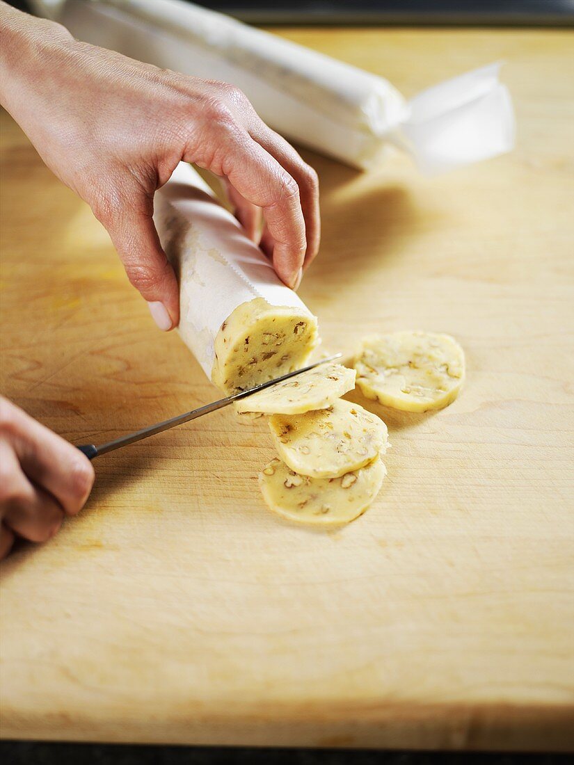 Cutting biscuits out of pecan dough