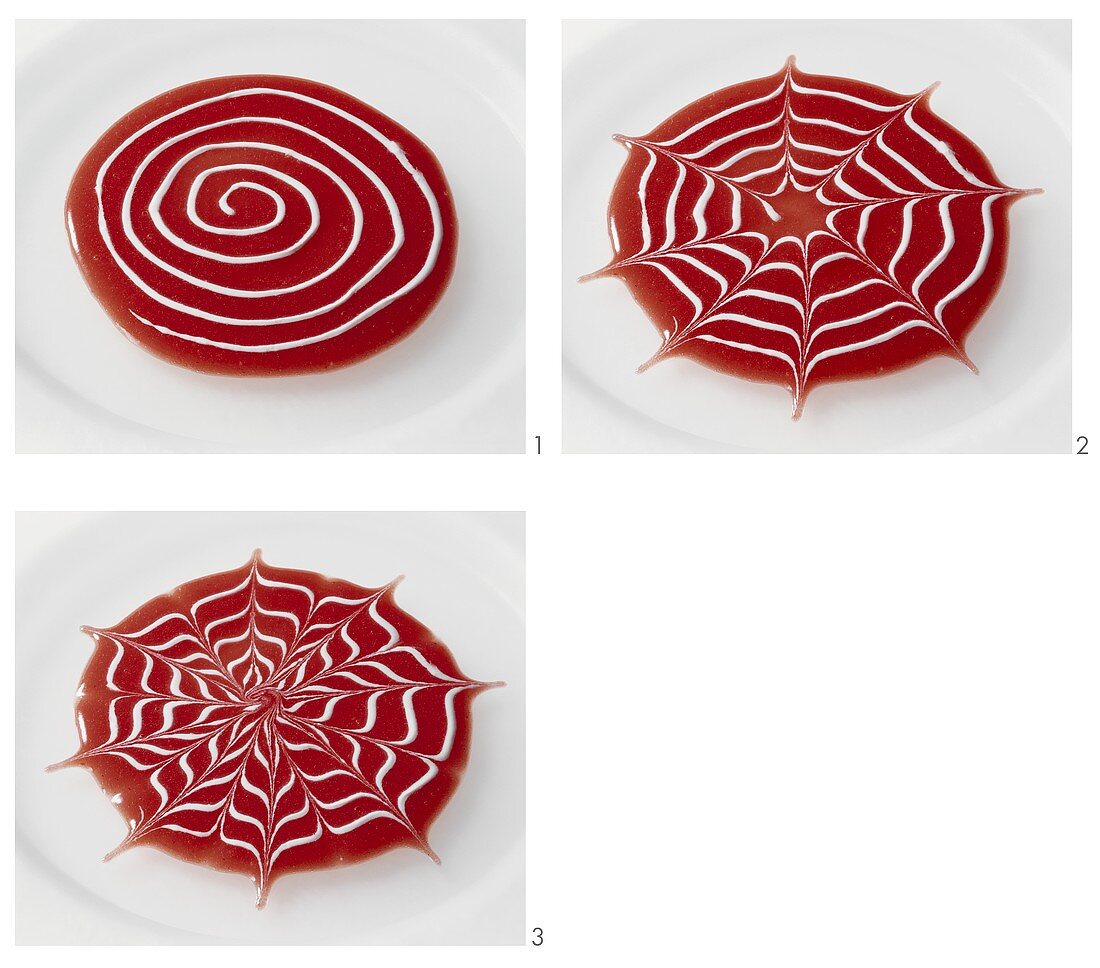 Making a cobweb design with fruit sauce
