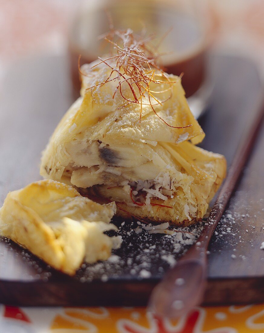 Baked banana in filo pastry with shreds of chilli