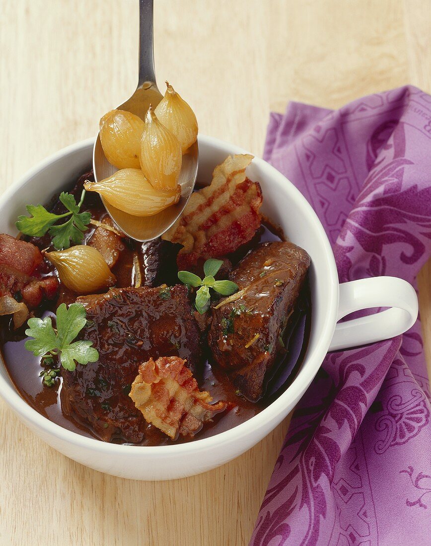 Beef casserole with pearl onions, marjoram and lemon