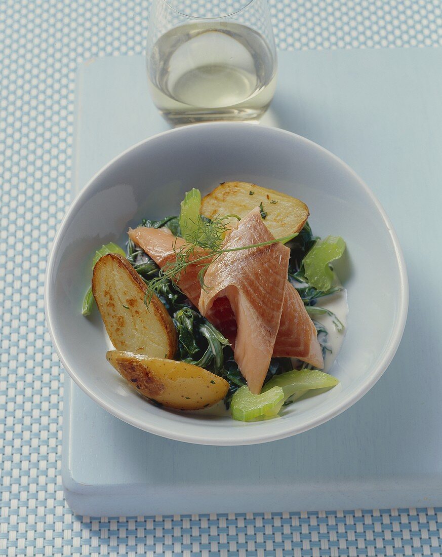 Salmon trout with juniper, bay, spinach and potatoes