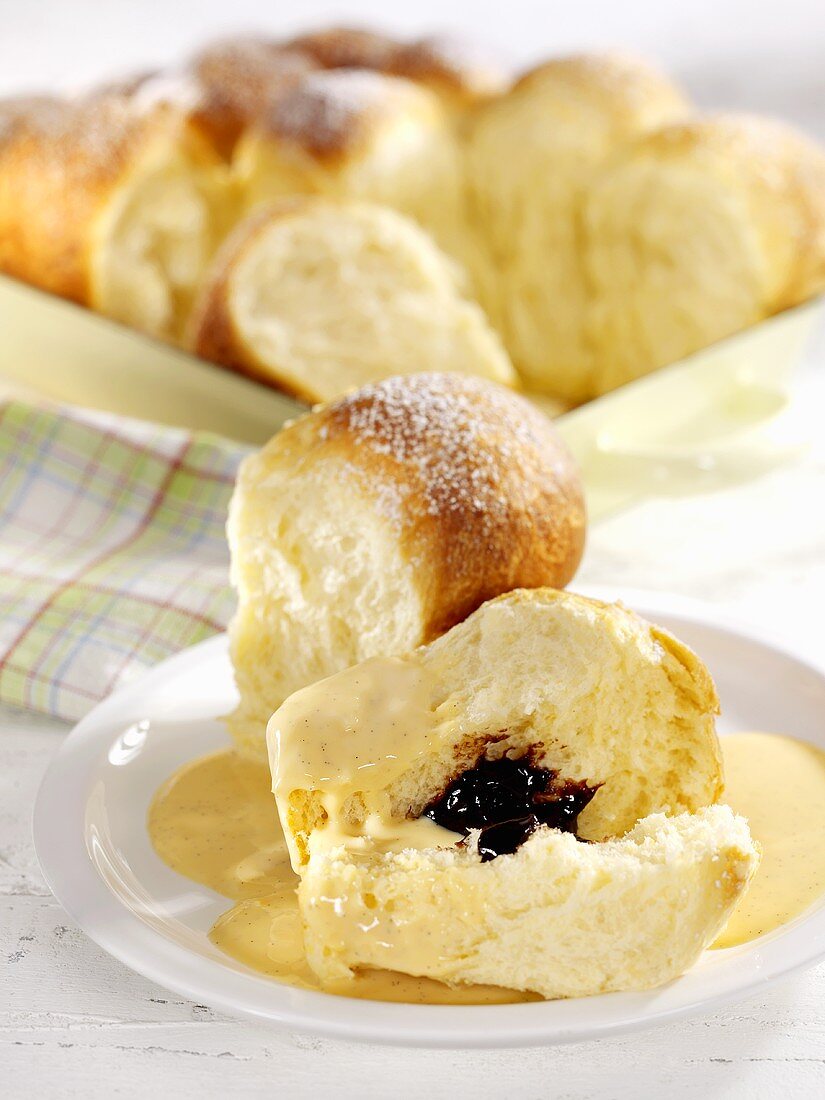 Buchteln (sweet yeast dumplings) with plum jam and custard