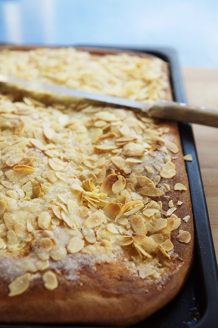 Butter cake topped with flaked almonds