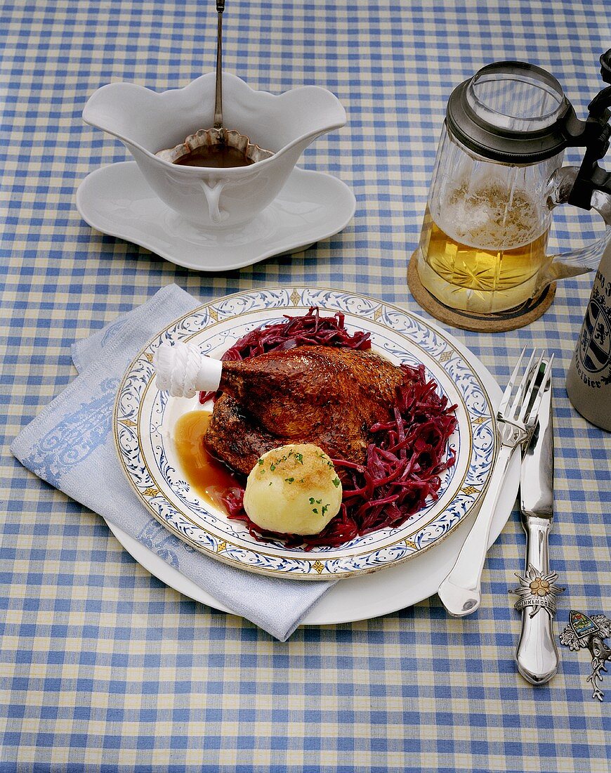 Leg of goose with potato dumpling and red cabbage