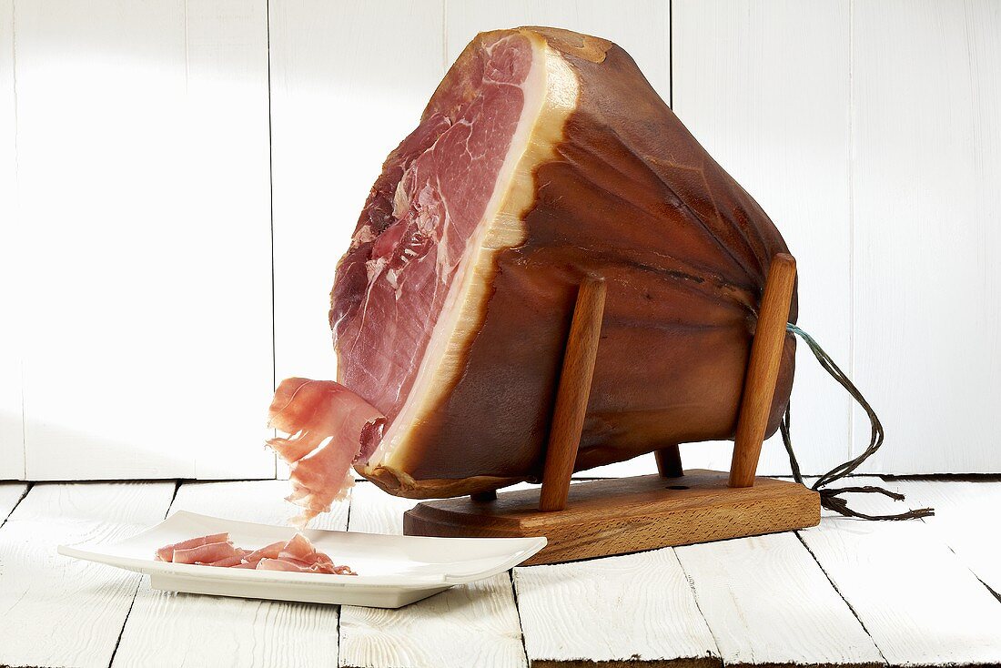 Smoked ham (Heideschinken) on ham stand