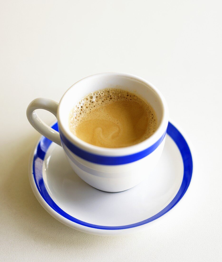Espresso in blue and white cup and saucer