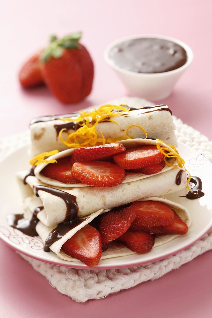 Pancakes with strawberries and chocolate & orange sauce