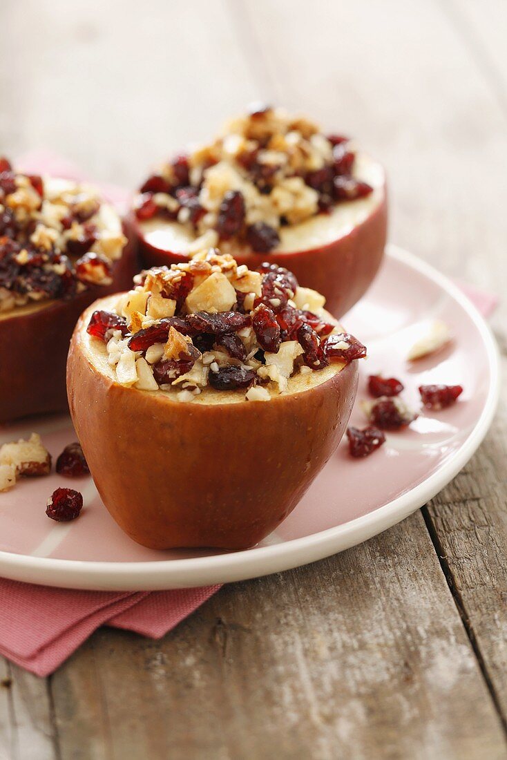 Baked apples with cranberries, Brazil nuts and maple syrup