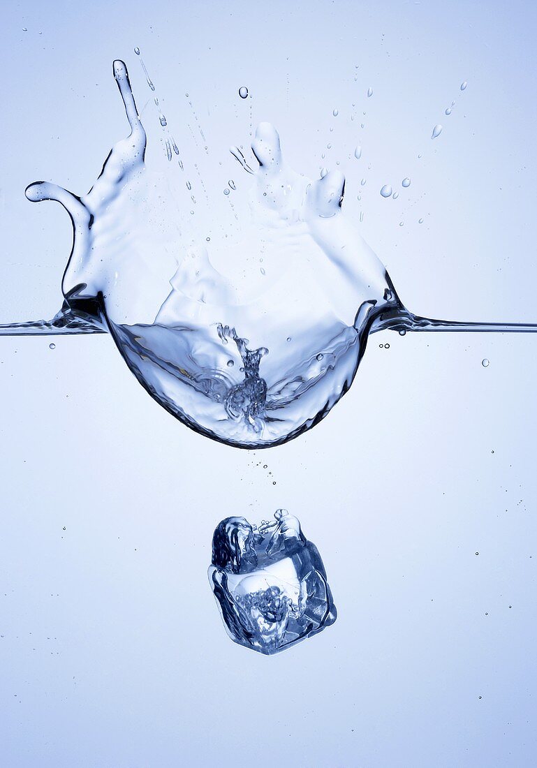 Ice cube falling into water