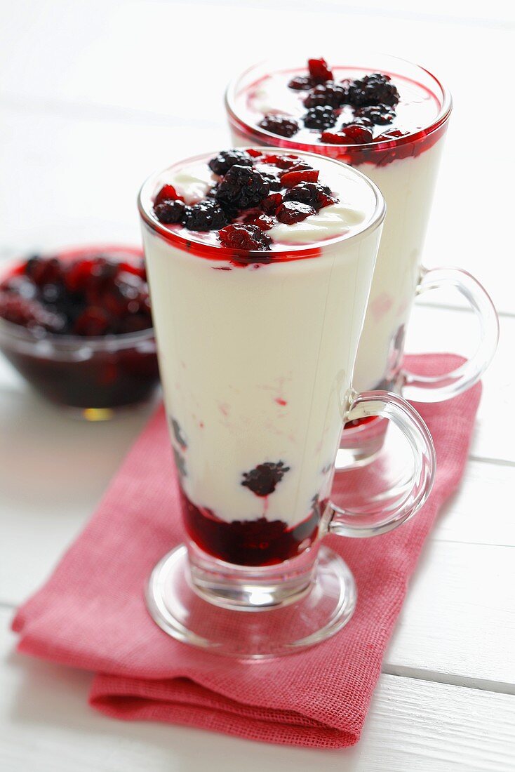 Yoghurt dessert with blackberries and cranberries