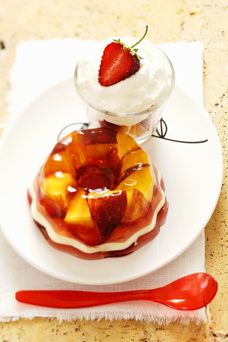Peach and strawberry jelly with whipped cream