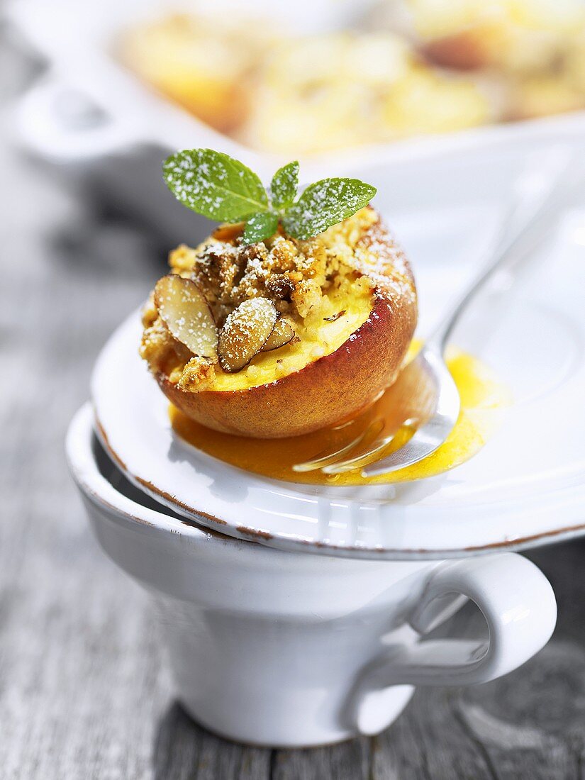 Baked peach with almond crumble topping