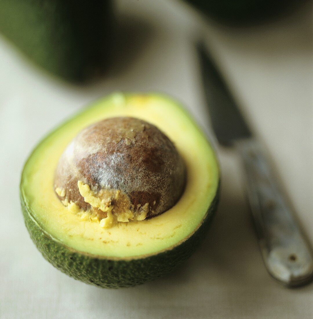 Half an avocado with stone