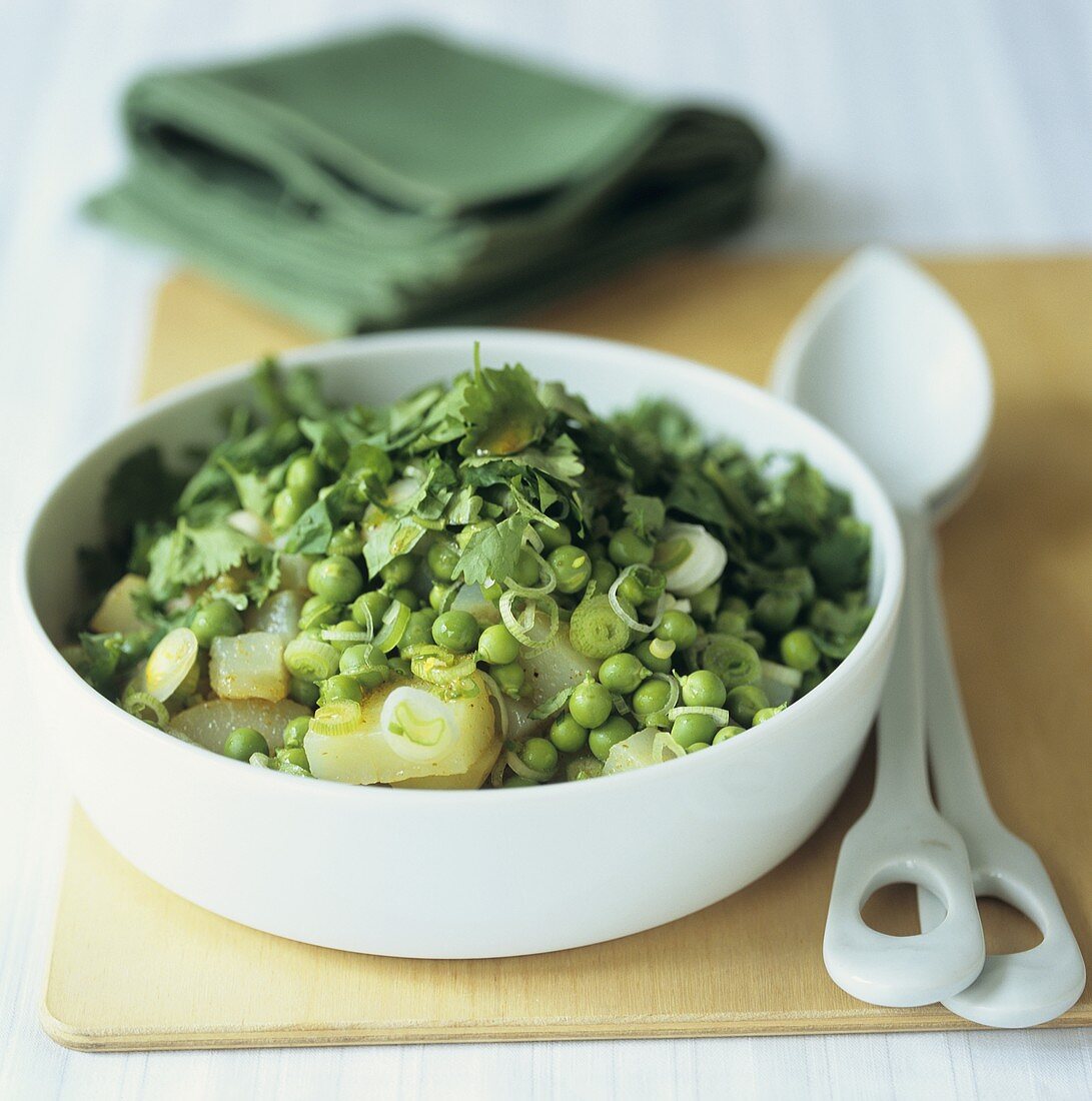 Pea and potato salad with spring onions
