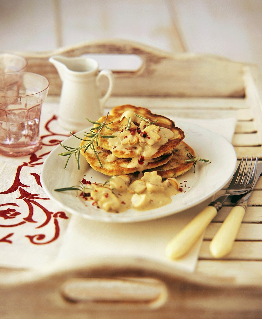 Pancakes with chestnut and mushroom sauce and rosemary