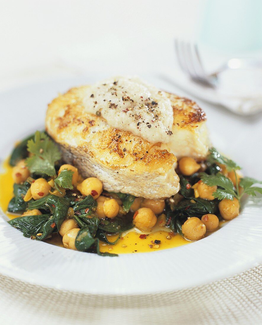 Baked halibut steak on chick-peas