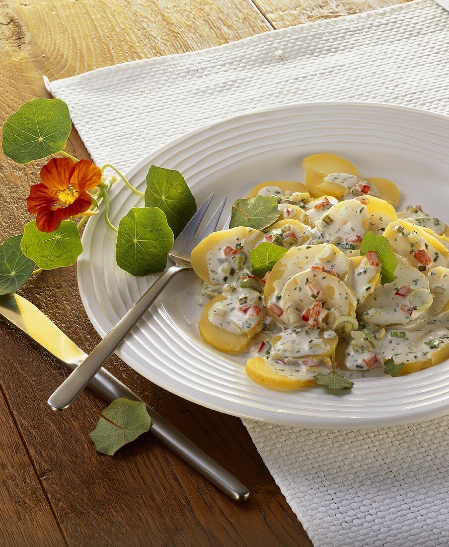 Potato salad with mayonnaise and nasturtium leaves