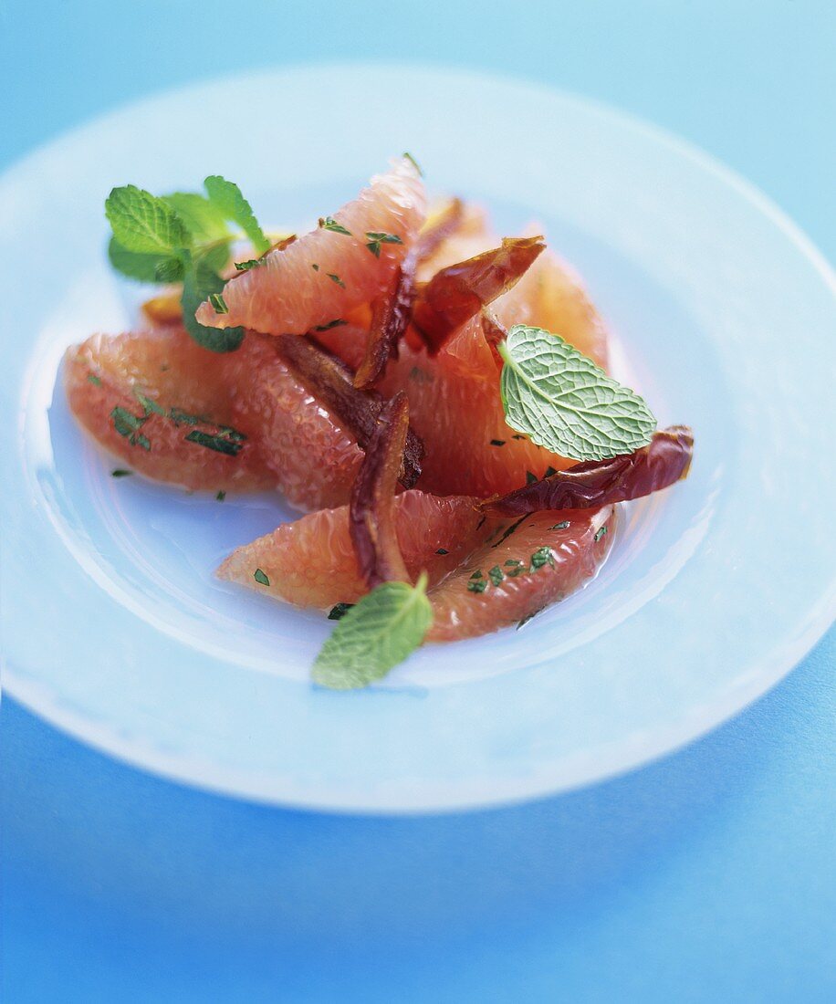 Pink grapefruit segments with dates and mint