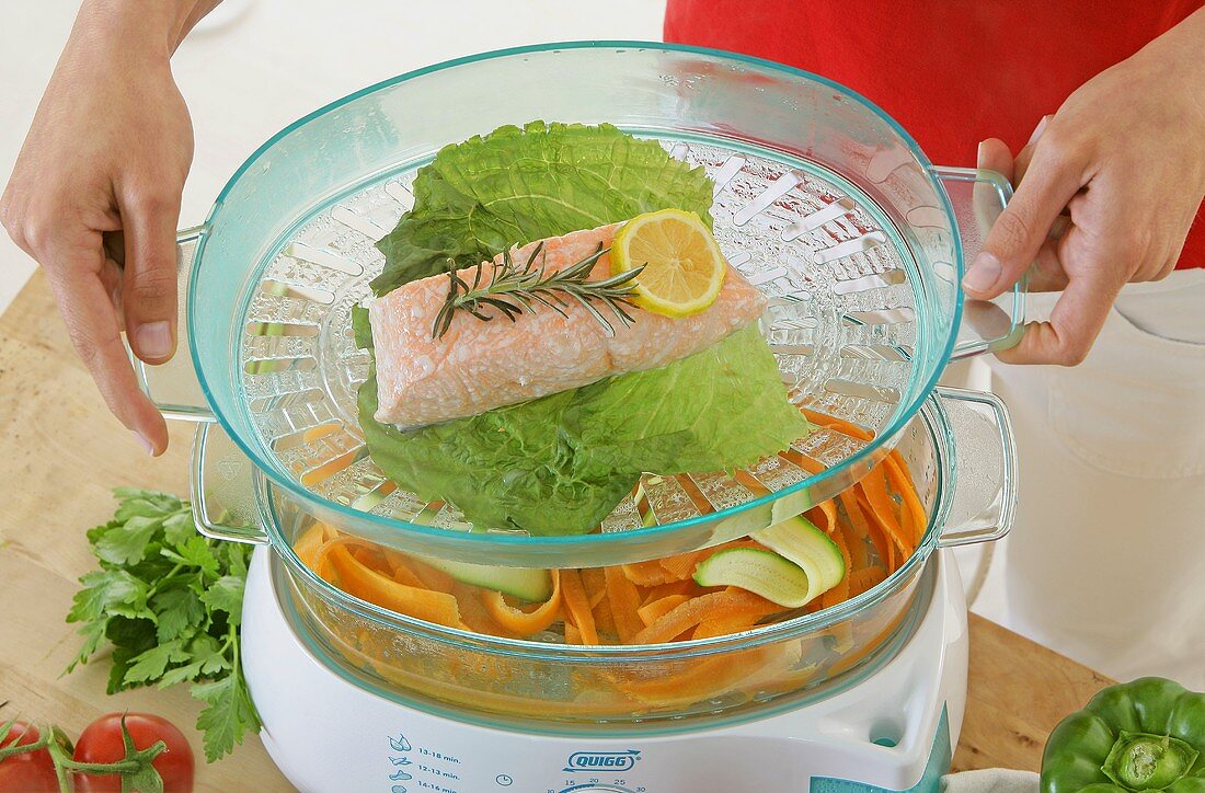 Fish and vegetables in a steamer