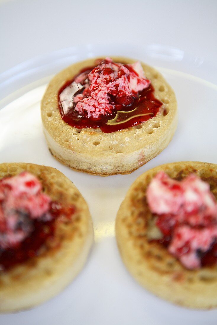 Crumpets with cream cheese and jam (UK)