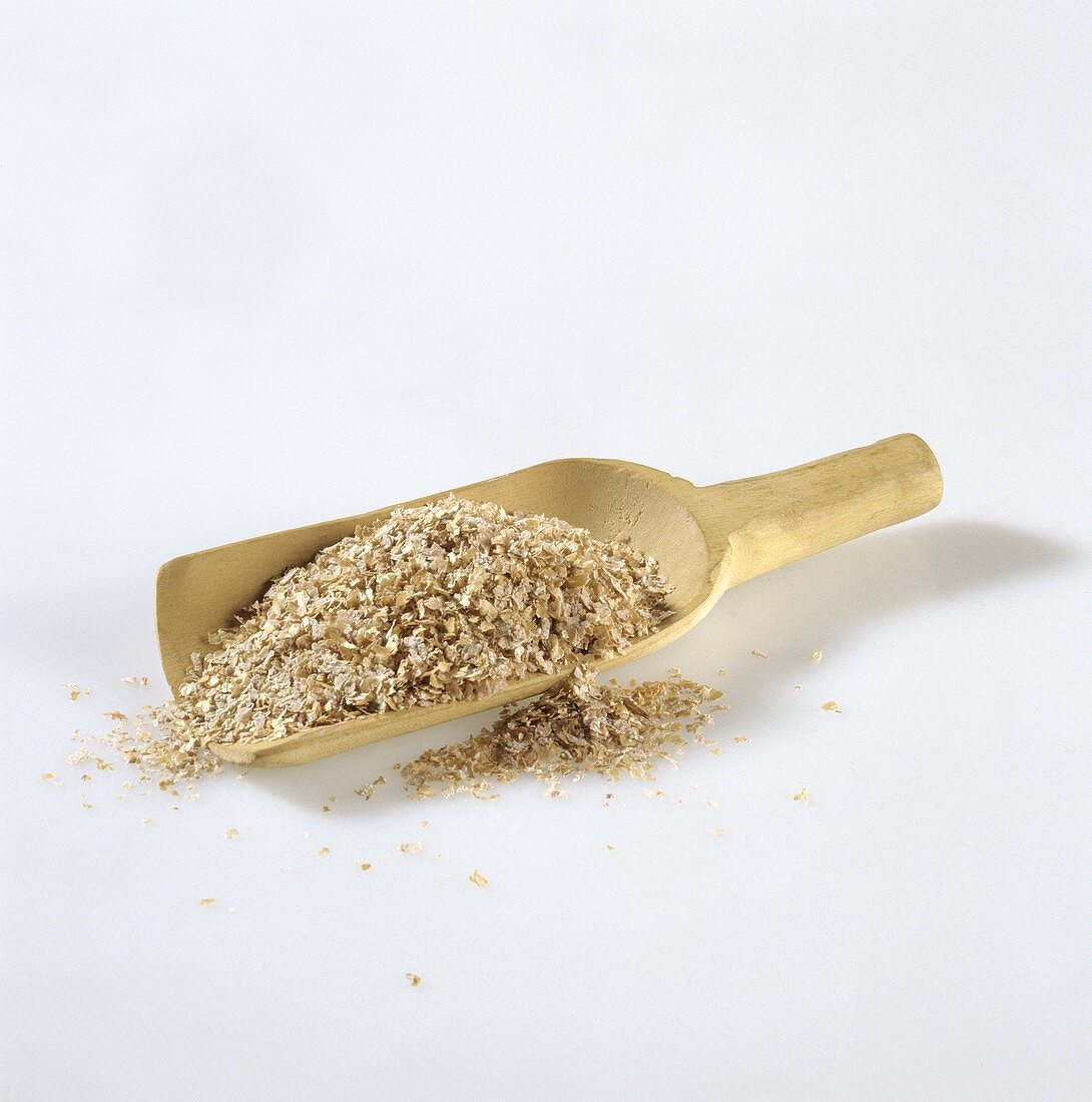 Wheat bran in wooden scoop