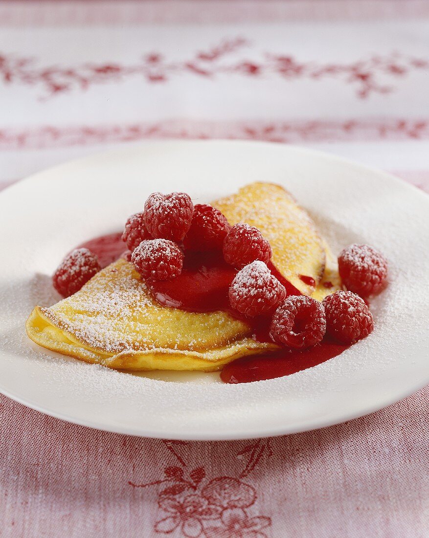 Curd cheese omelette with raspberry sauce