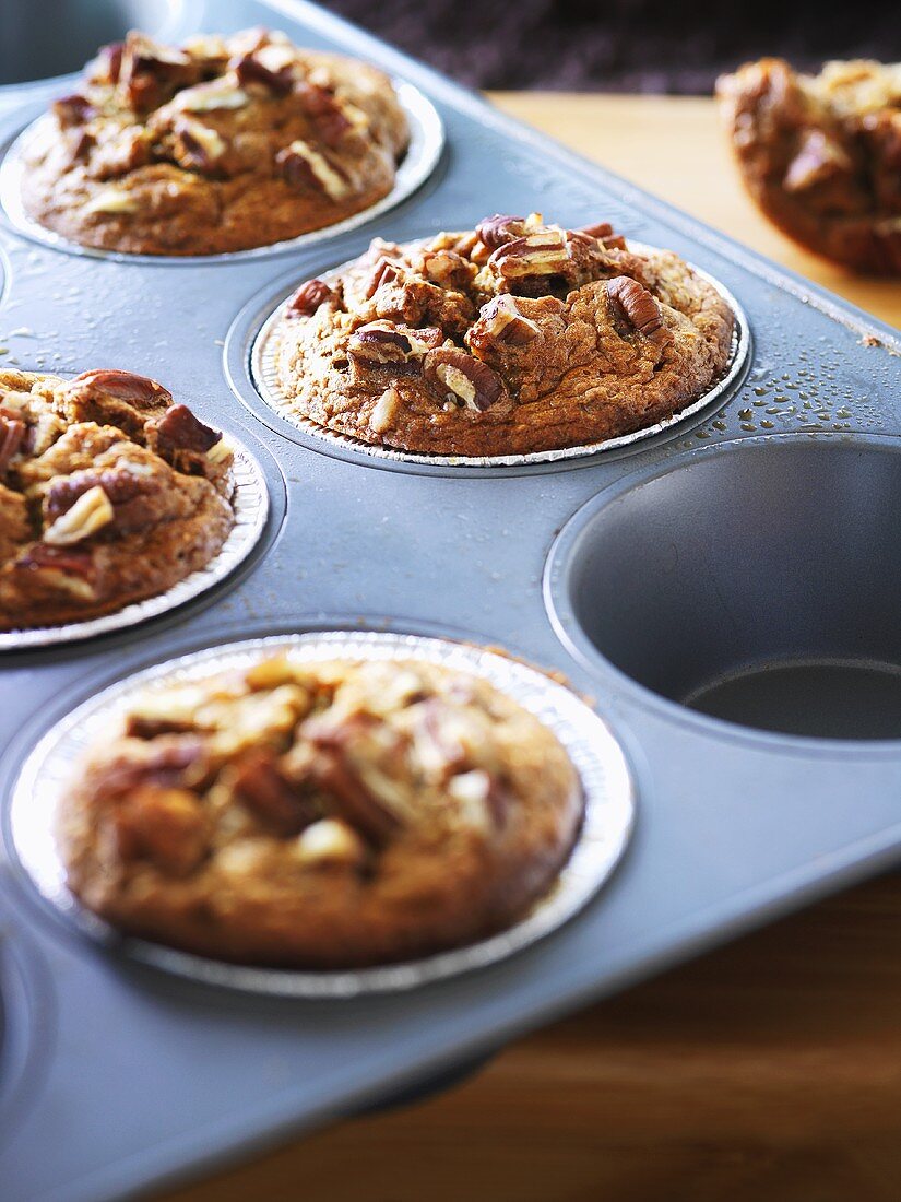 Wholemeal banana muffins in a muffin tin