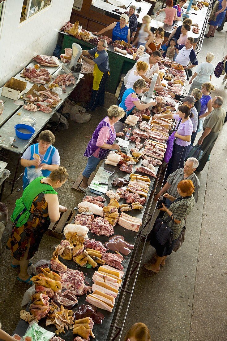 Various types of meat on a market stall in Ukraine