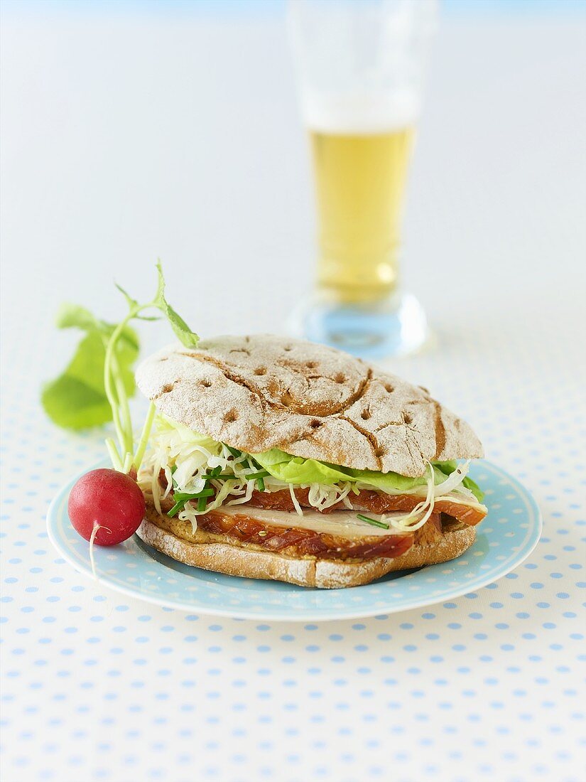 Roast pork and cabbage salad in rye roll