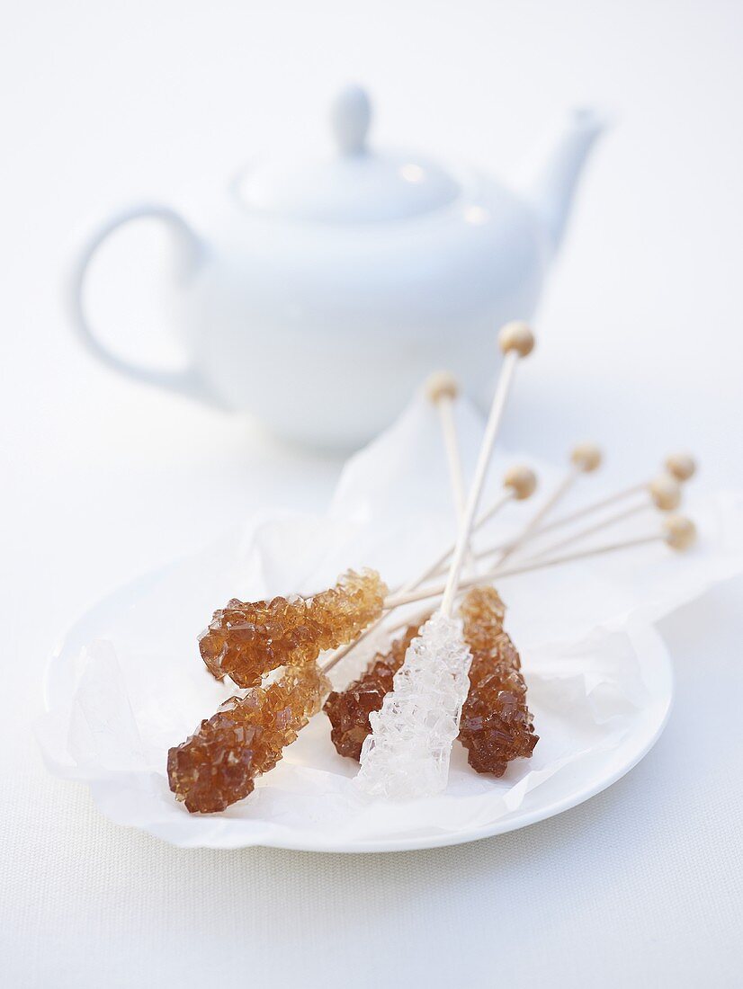 Sugar swizzle sticks and teapot