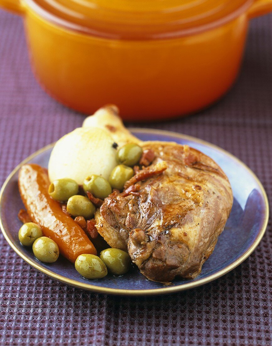 Duck with green olives, carrots and onions