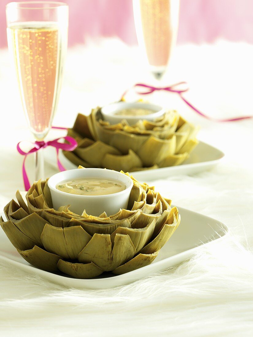 Artichokes with dip and champagne