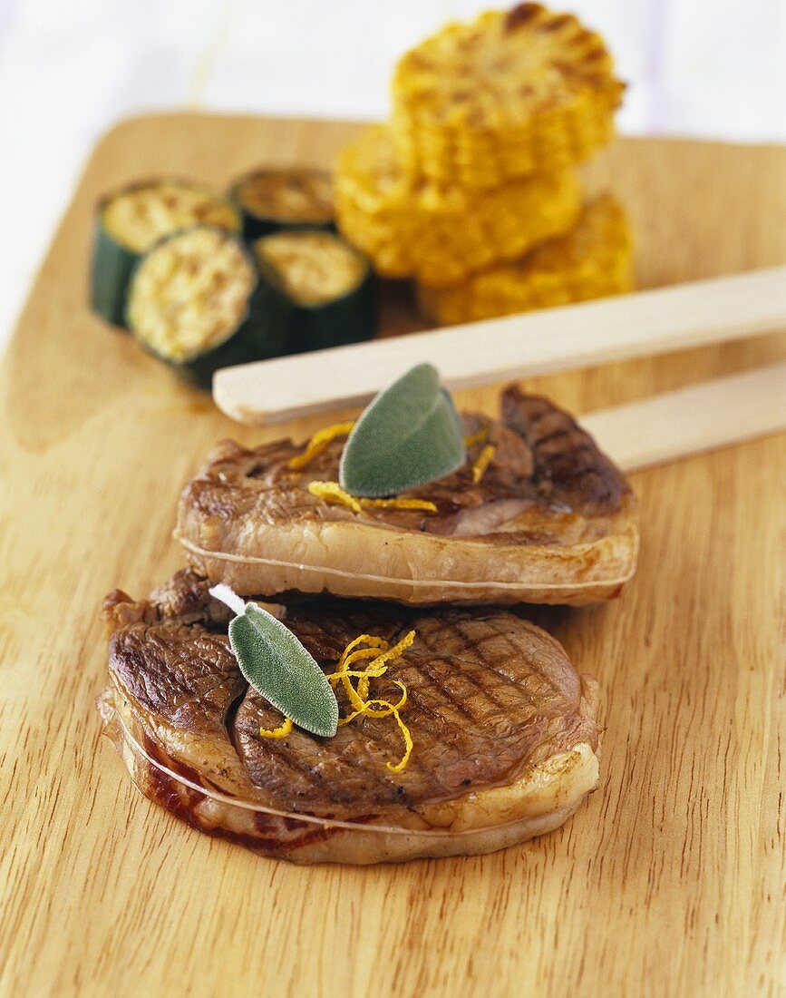 Grilled slices of leg of lamb with sage