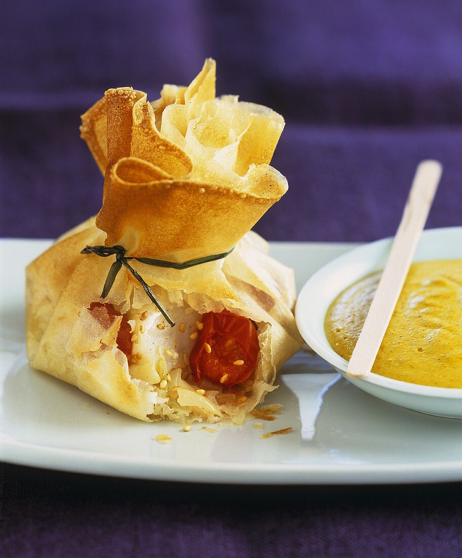 Brik pastry purse with scallop & tomato filling, curry sauce