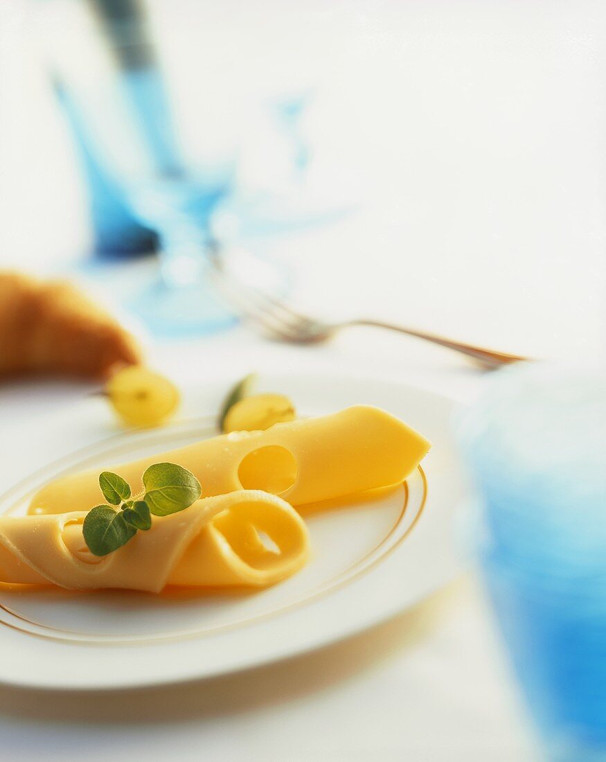 Cheese rolls on gold-rimmed plate
