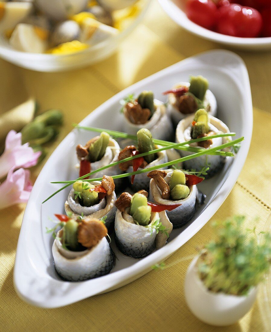 Herring rolls with gherkins and mushrooms