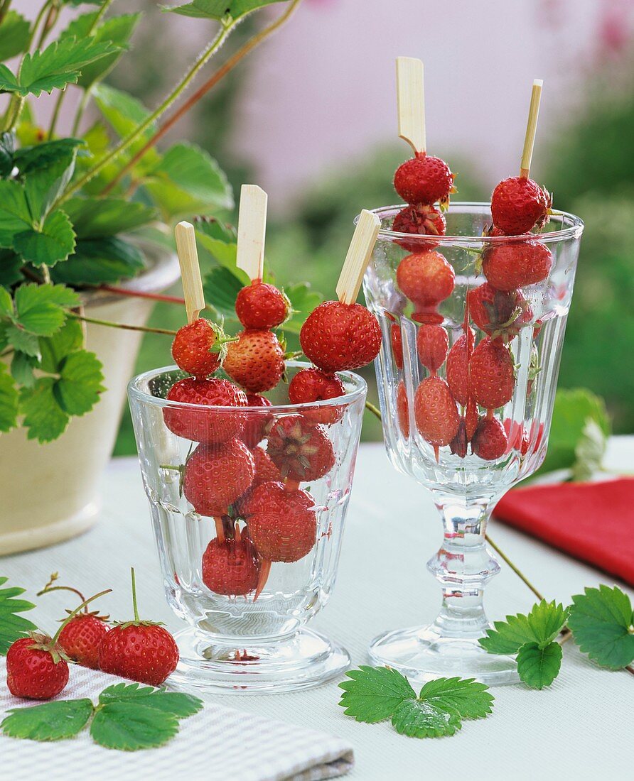 Strawberry skewers in glasses