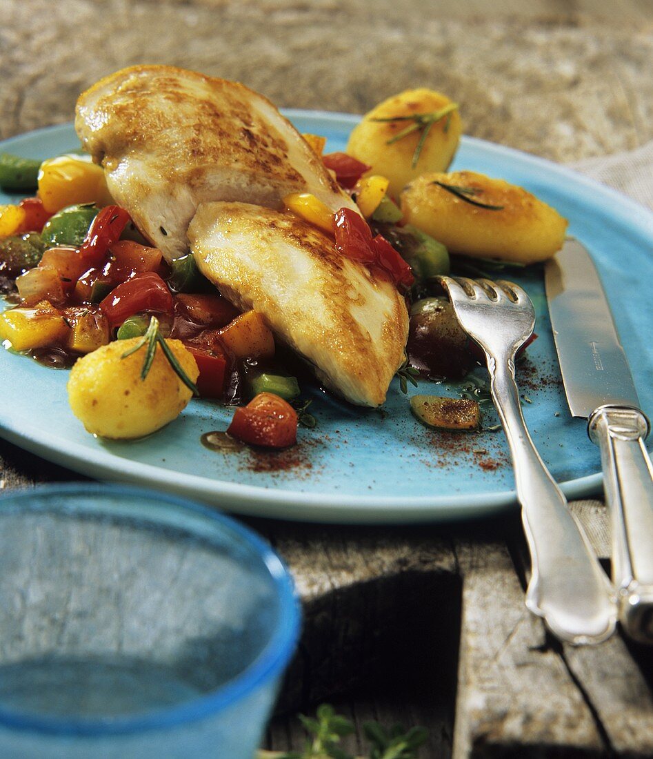 Fried chicken breast with chilli mixed peppers