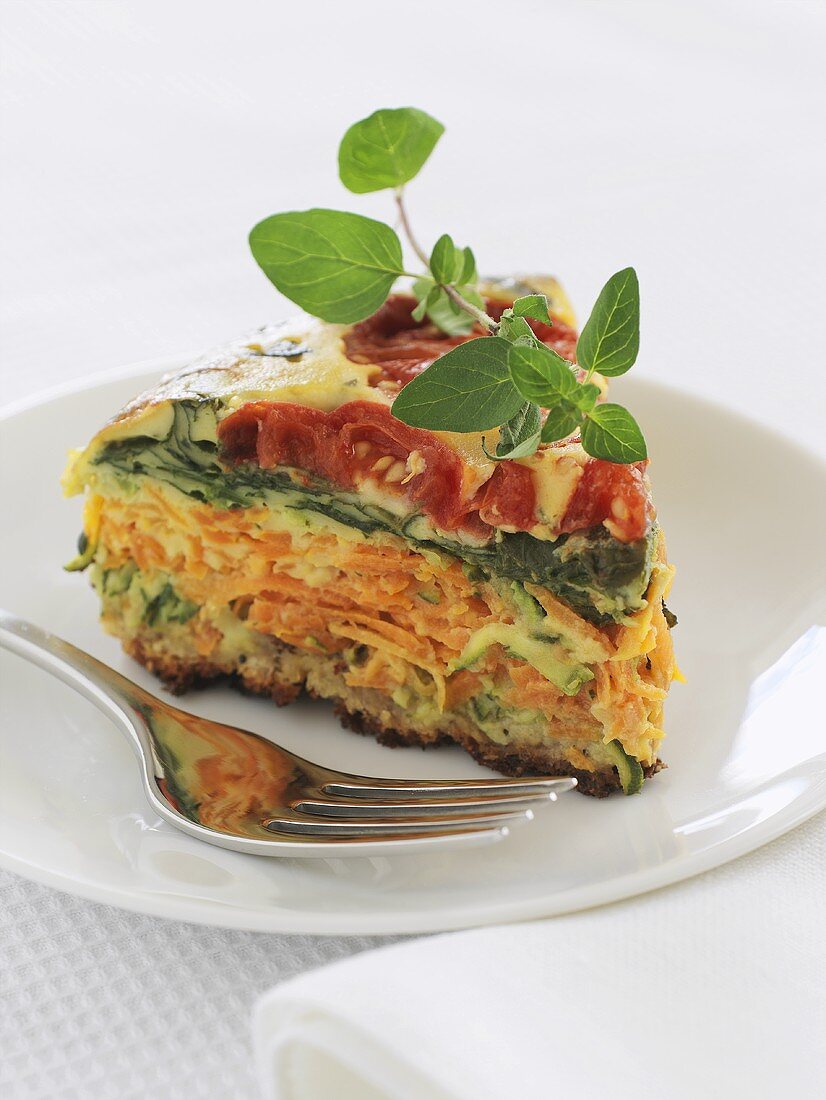 A piece of vegetable pie (with tomatoes, courgettes & spinach)