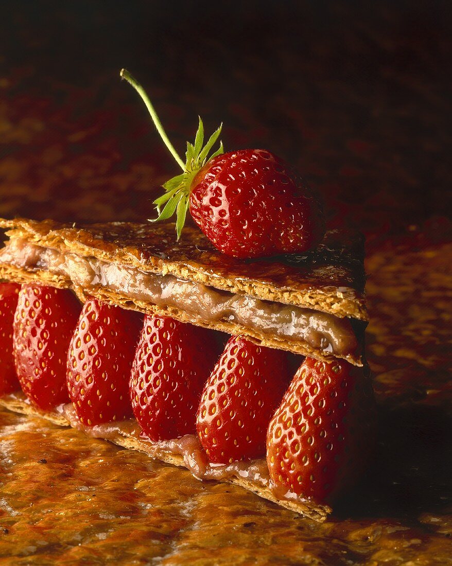 Brik pastry with caramel filling and strawberries